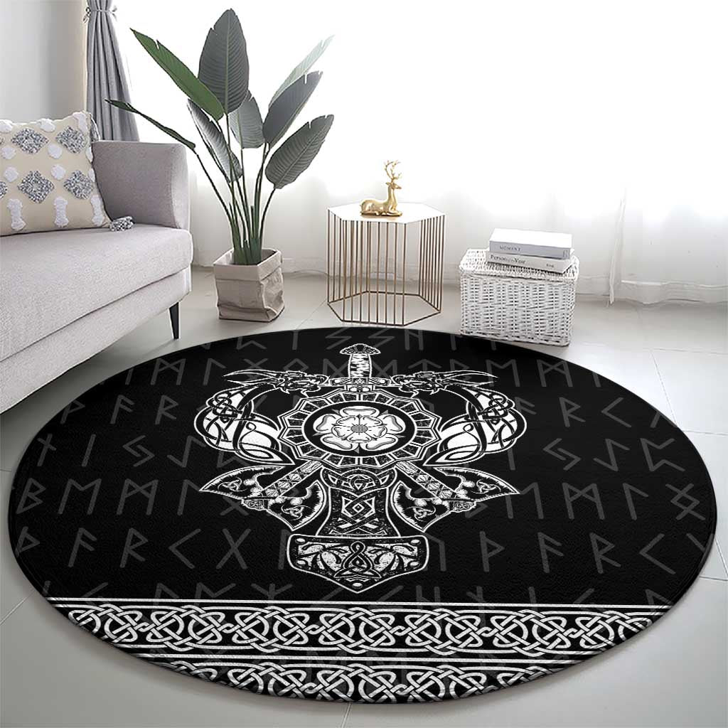 Black round area rug featuring ornate Viking-style emblem and border braid