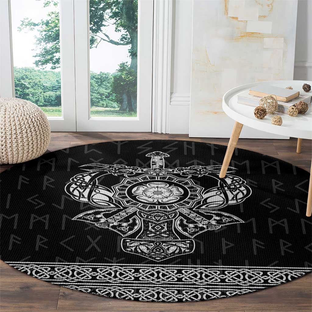 Black round rug with white Viking emblem center and braided border