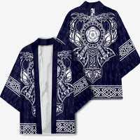 Unisex blue kimono front view with white Viking emblem, dragons, and knot borders