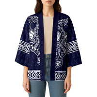 Unisex blue kimono with open front, wide sleeves, and white dragon and knot graphics