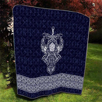 Navy-blue quilt with central white Viking axe emblem and white ornate border trim
