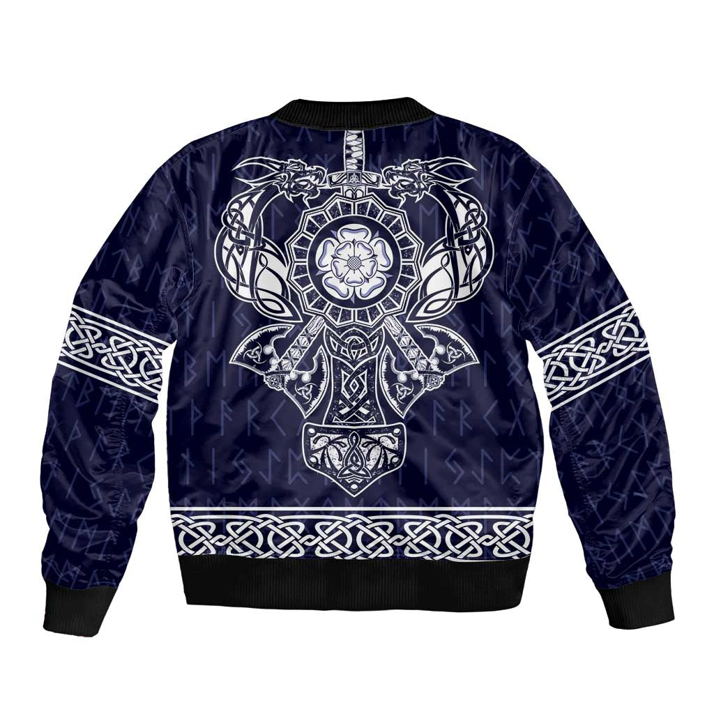 Blue unisex bomber jacket with front zip, large central emblem, and braided trim hem
