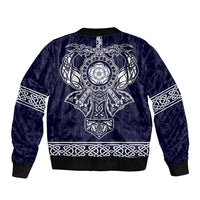 Blue unisex bomber jacket with front zip, large central emblem, and braided trim hem