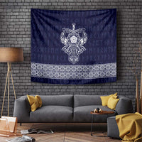Blue tapestry with central Norse emblem and ornate white border