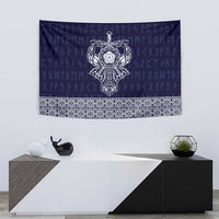 Blue tapestry featuring stylized Norse figure emblem and white patterned border