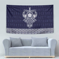 Blue tapestry with central Norse mask motif and repeating white border pattern