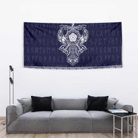 Blue tapestry with centered Norse emblem and decorative white woven-style border