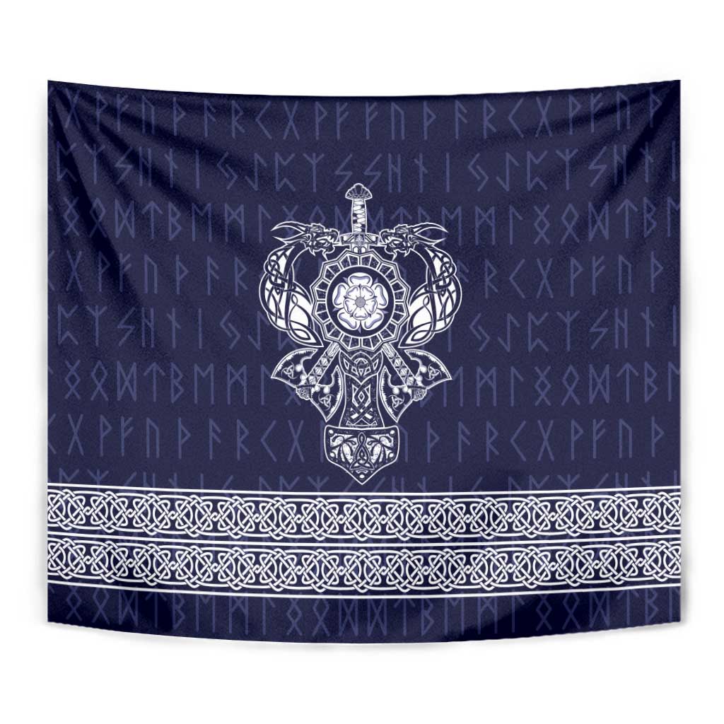 Blue tapestry close-up with central emblem and white ornate lower border