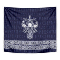 Blue tapestry close-up with central emblem and white ornate lower border