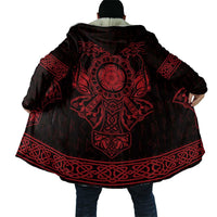 Back view of black hooded Viking cloak with large red emblem and patterned border