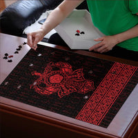 Red and black Viking rune jigsaw puzzle being assembled, with central emblem and border.