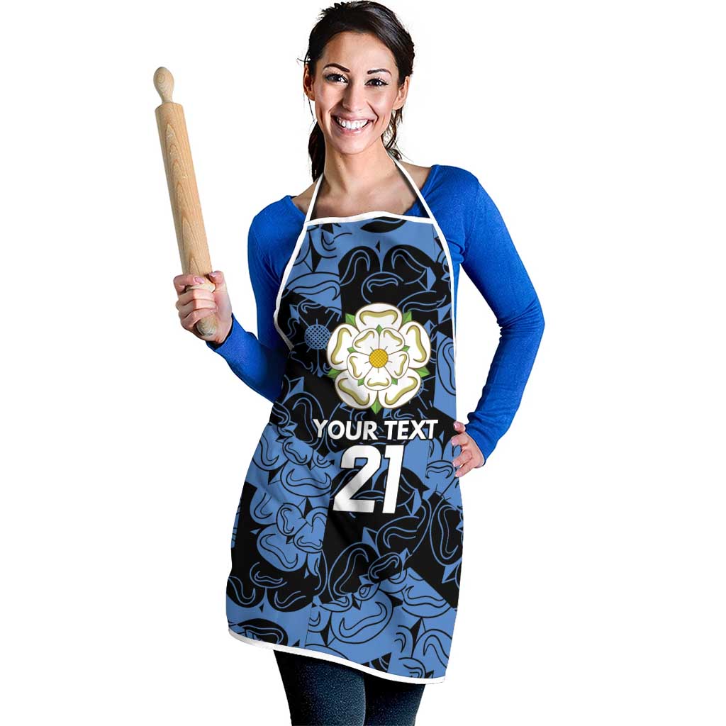 Custom apron with blue swirls, white straps; floral badge and custom text 21