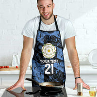 Custom apron with blue swirl print, black straps; floral emblem and '21' text