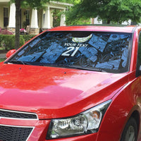 Auto sun shade on red car windshield, blue patterned design with '21' and text