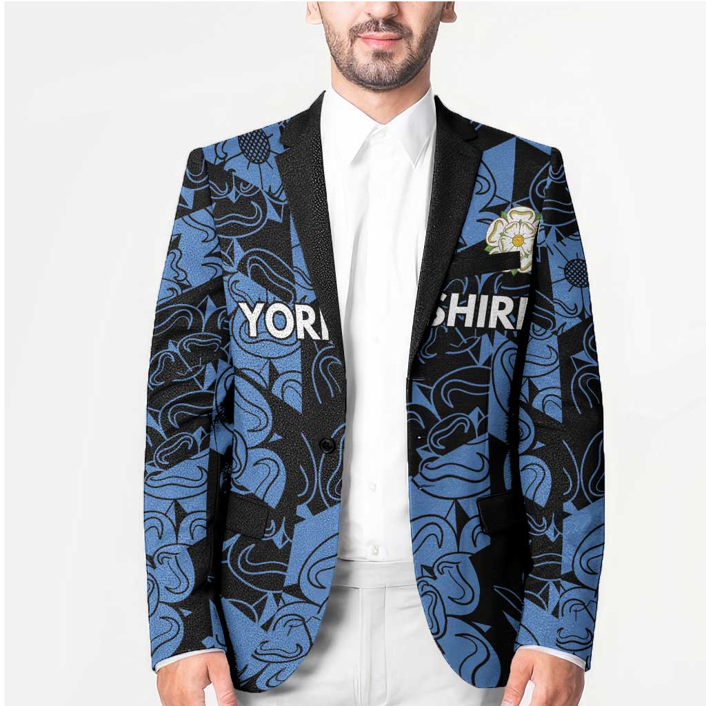 Unisex blazer in blue-and-black pattern with black trim, rose pin on chest pocket