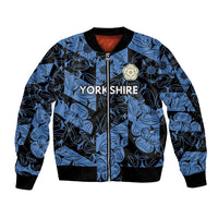 Blue bomber jacket with black trim, full zip, Yorkshire print and rose badge at chest