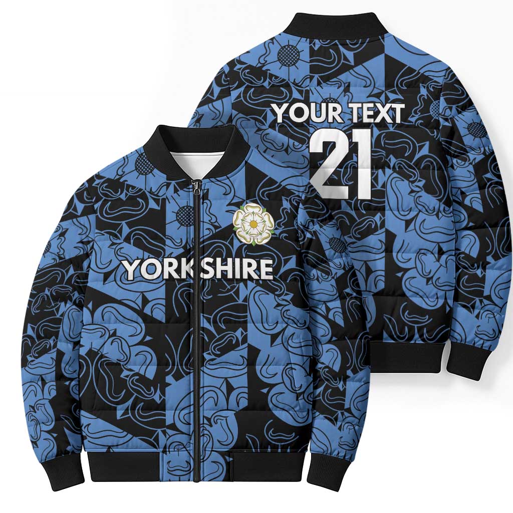 Blue patterned bomber puffer jacket showing front and back with zip and crest