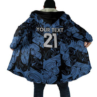 Back view hooded cape cloak with blue-and-black swirl pattern and large '21' design