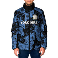 Blue patterned padded jacket with black hood and full-zip front, embroidered crest