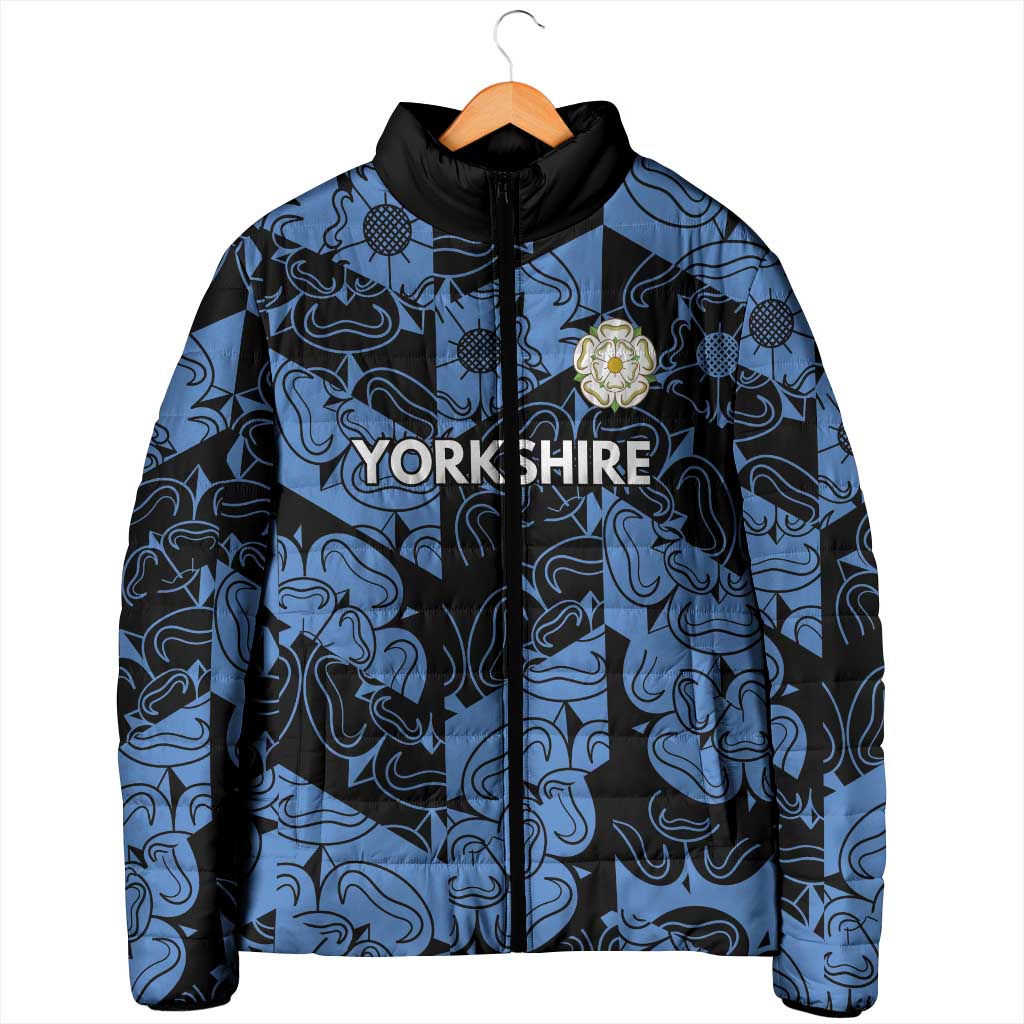 Blue and black patterned padded jacket with black hood, zipper, embroidered crest
