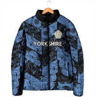 Blue and black patterned padded jacket with black hood, zipper, embroidered crest