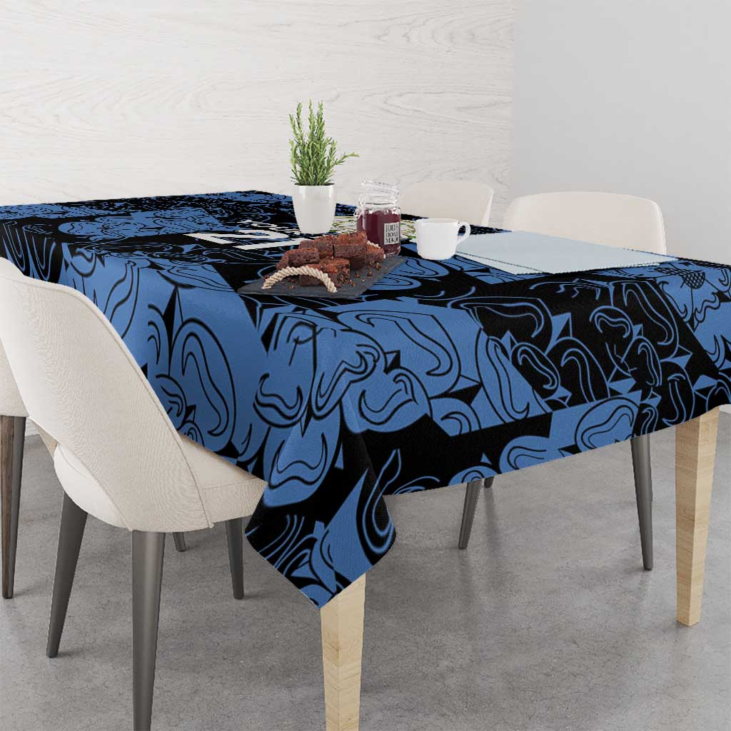 Custom tablecloth with dark blue swirl pattern, hanging over table edge.