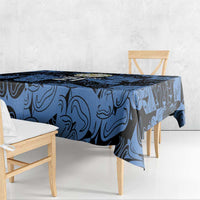 Custom tablecloth in dark blue swirl print, shown on end of dining table.