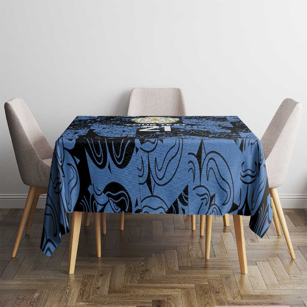 Custom tablecloth in dark blue swirl print on round table with four chairs.