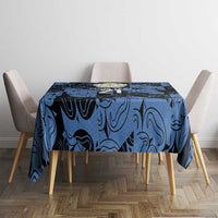 Custom tablecloth in dark blue swirl print on round table with four chairs.