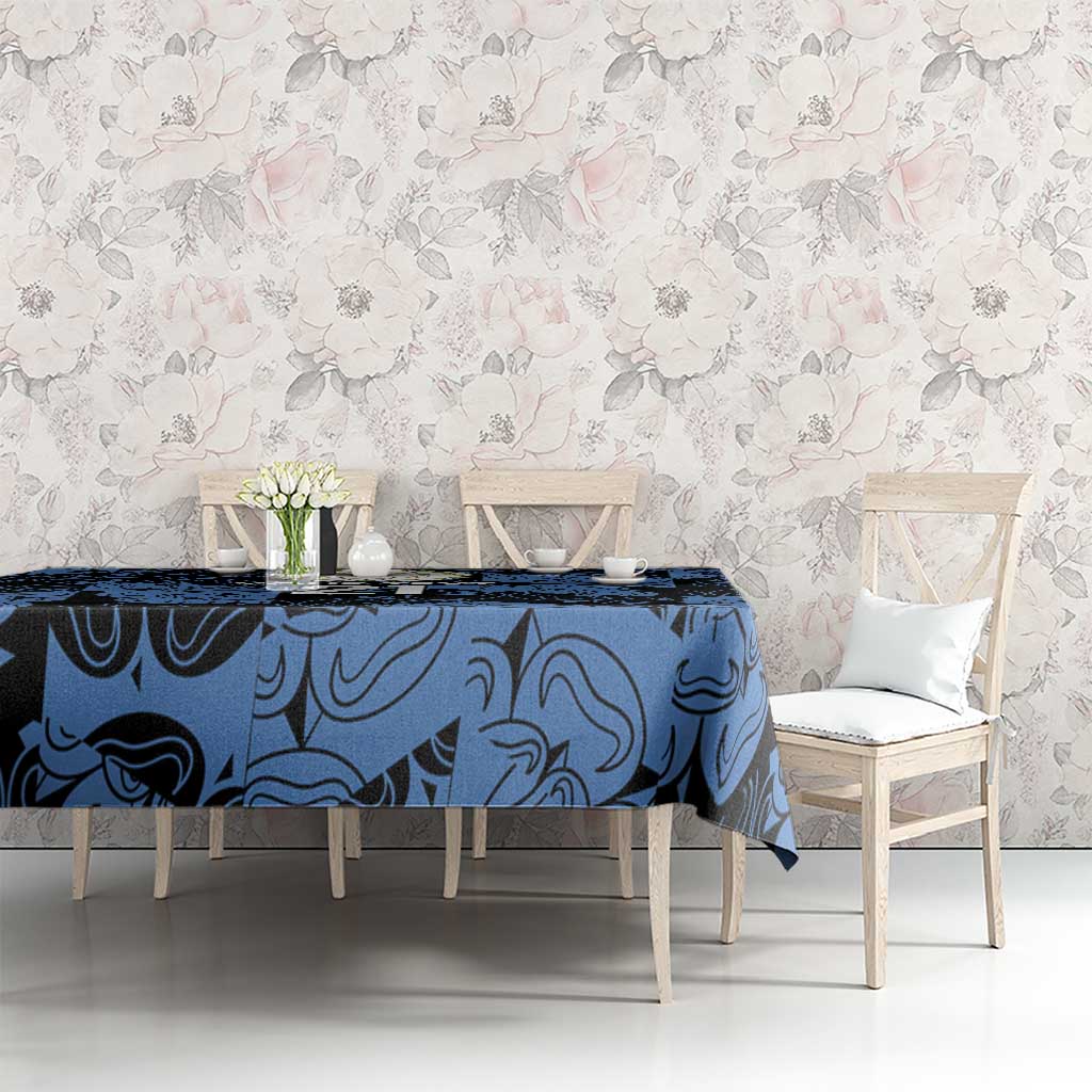 Custom tablecloth in dark blue swirl pattern on long table with white chairs.