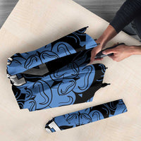 Folded blue patterned umbrella with rose emblem and “YOUR TEXT 21” on fabric