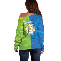 Off-shoulder sweater back with 'your text' and white rose emblem, blue-green plaid