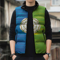 Sleeveless puffer vest with blue-and-green gradient panels, rose emblem, zip-front and pockets