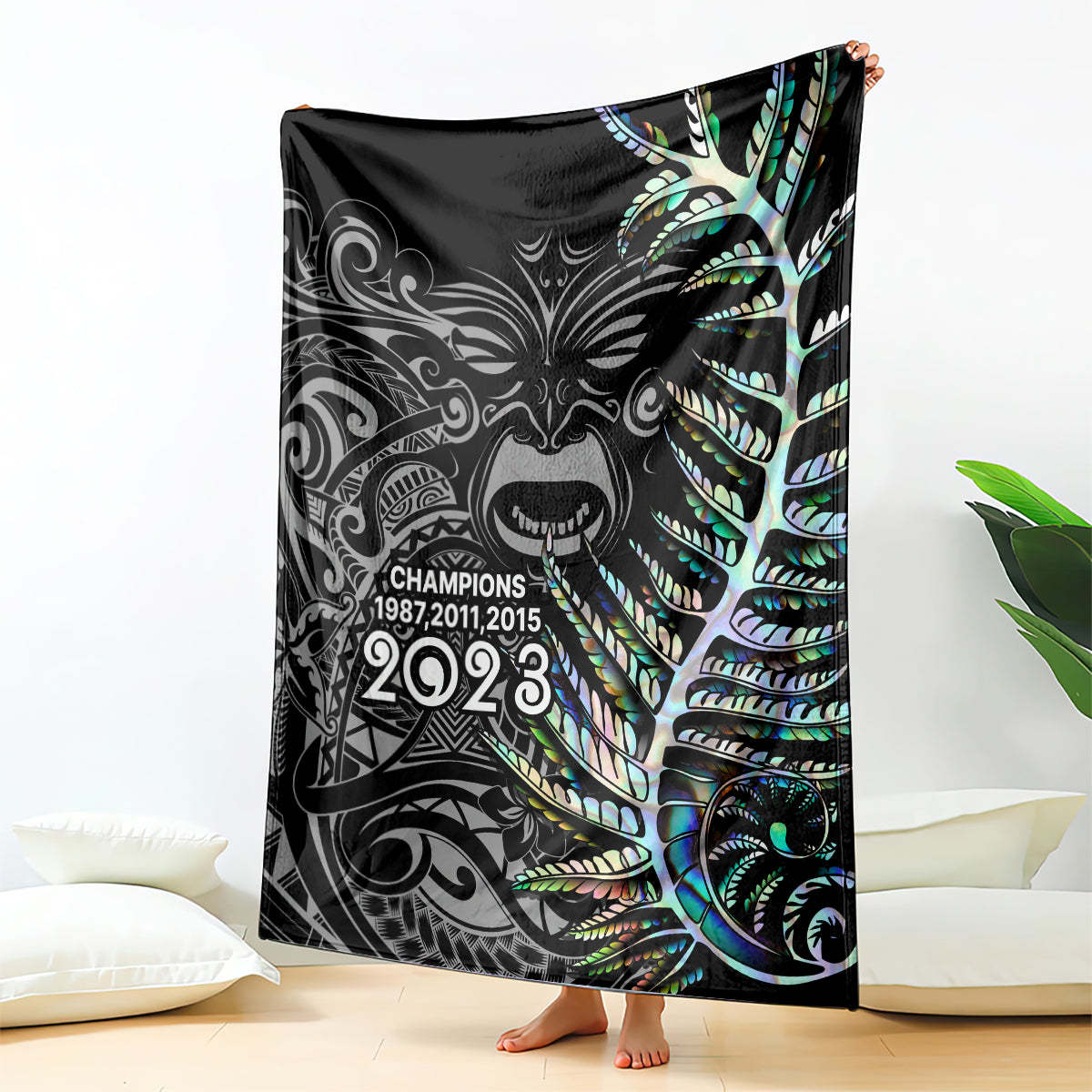 Black rugby blanket with Maori-style fern face graphic and '2023' text