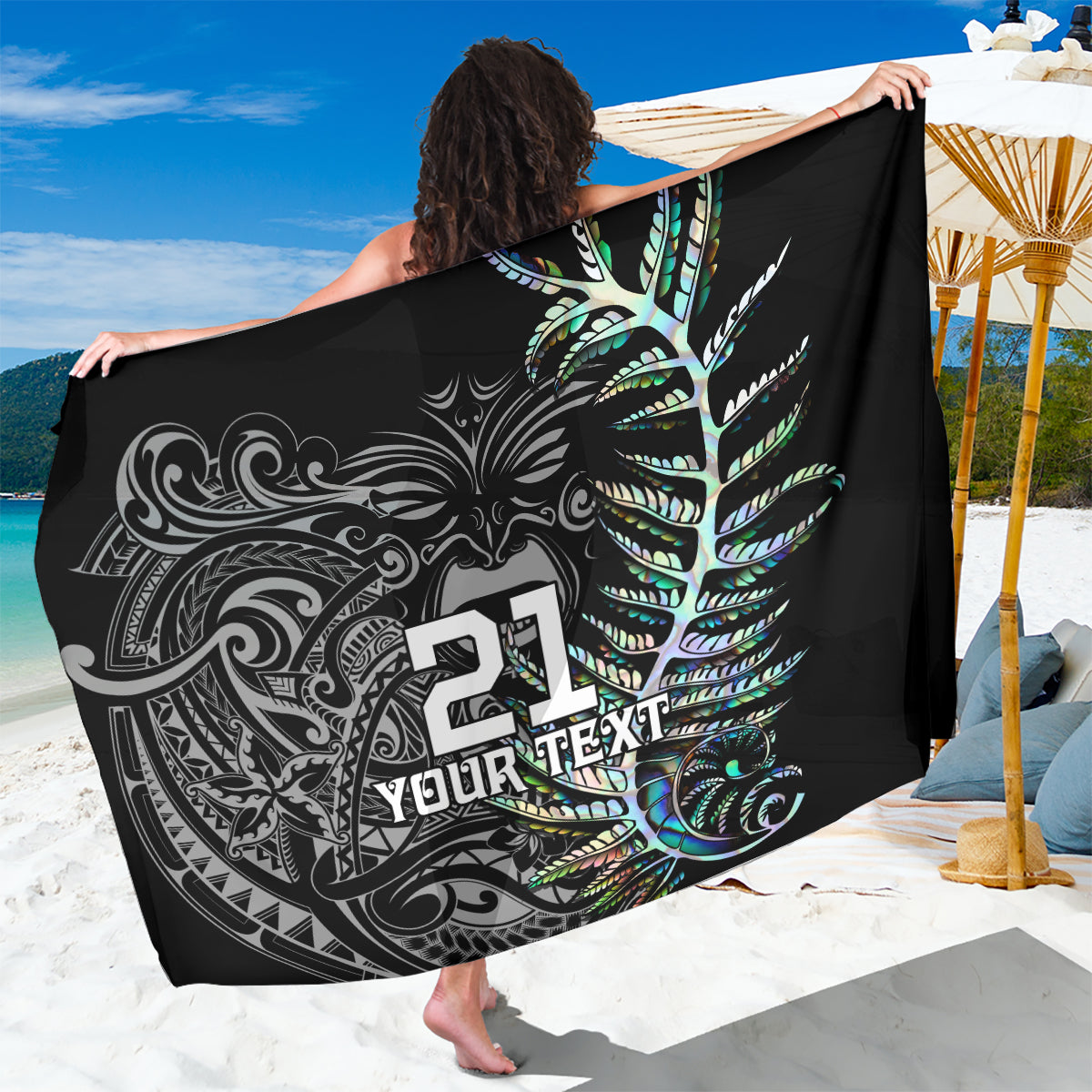 Black sarong with feather print, turquoise accents, and “YOUR TEXT” graphic