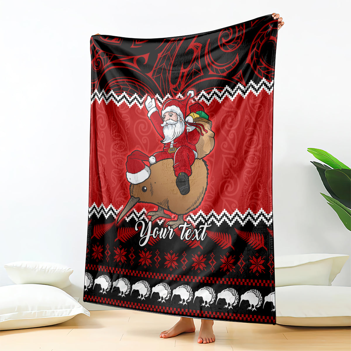 Red Christmas blanket with Santa on a reindeer, black-and-white trim and zigzag patterns