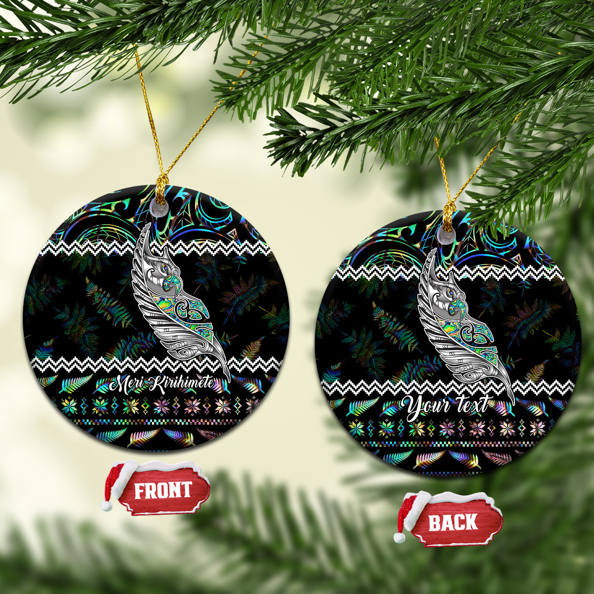 Black round ceramic Christmas ornament with Maori fern and manaia design, “Meri Kirihimete”