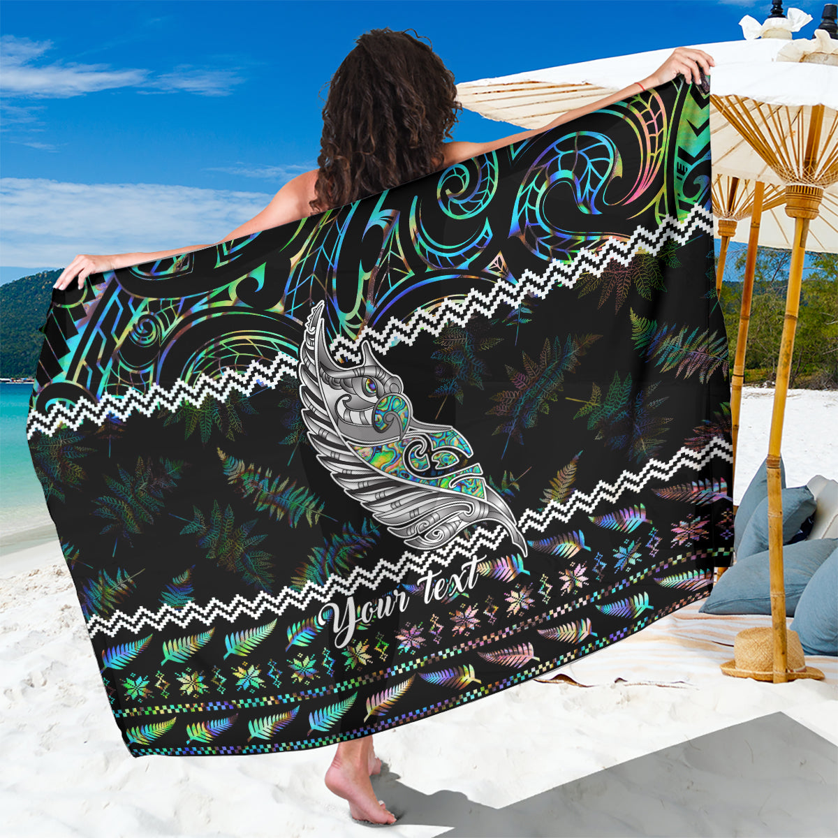 Personalized black sarong with green-blue tribal pattern and 'Your text' banner