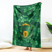 Green St. Patrick's Day themed throw blanket with shamrocks and 'Feeling Lucky' design
