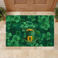 Green rubber doormat featuring 'Feeling Lucky' script and clover shamrocks