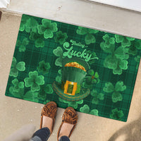 Green rubber doormat with 'Feeling Lucky' and leprechaun hat graphic in clovers