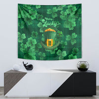 Green clover tapestry wall hanging reading “Feeling Lucky” with golden pot