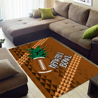 Brown area rug with football icon and green palm leaves over geometric tribal pattern