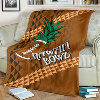 Brown bowl blanket on bed with green palm tree, football icon, and Hawaii Bowl text