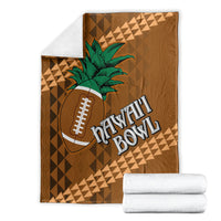 Brown bowl blanket with green palm tree, football icon, and Hawaii Bowl text; folded