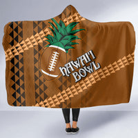 Brown hooded blanket with green tribal flower, football icon, and HONOLULU text