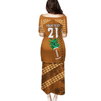 Brown long dress, back view, tribal geometric pattern with football and palm tree