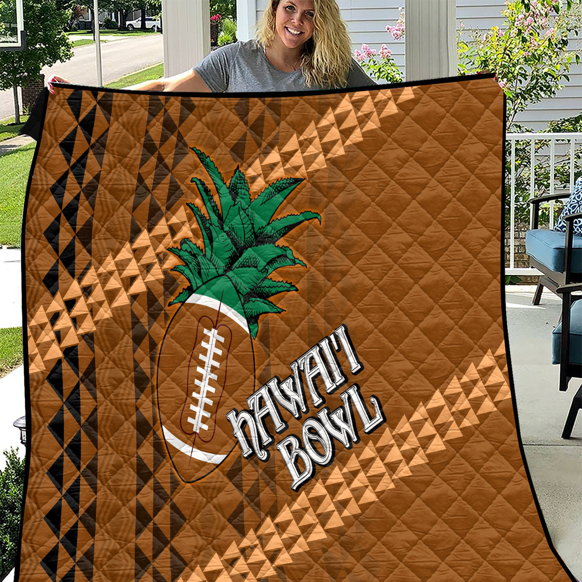 Brown Hawaii-style quilt with tribal diamond pattern, palm tree and football graphic