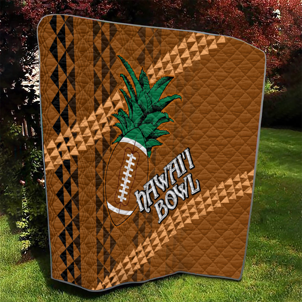 Brown quilt with tribal diamond stripes, green palm tree and football applique