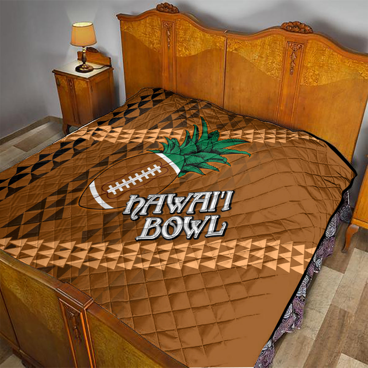 Brown quilt with tribal diamond pattern, palm tree and football graphic on bed